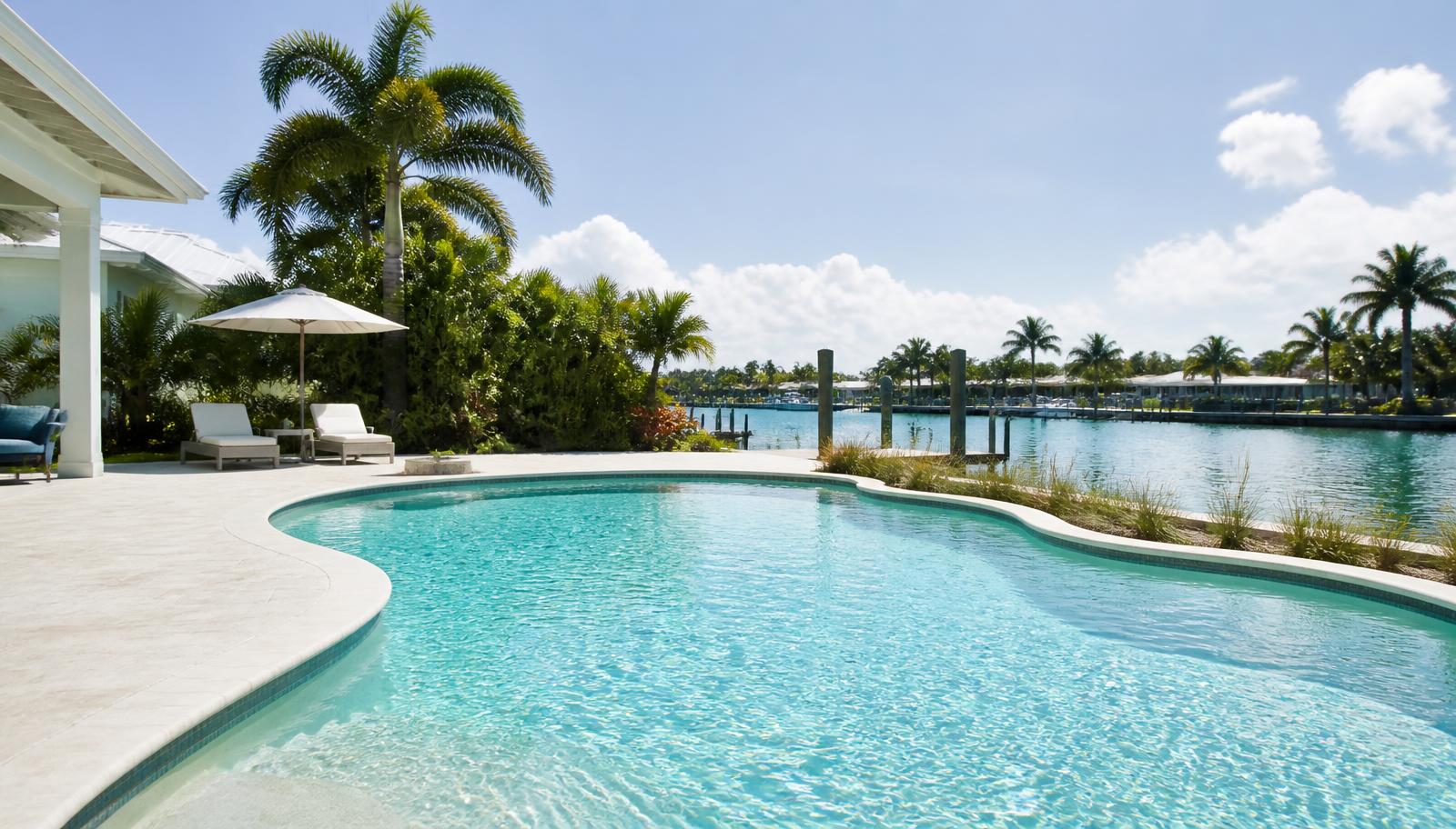 Bright Florida sun over the sparkling surface of a residential coastal pool