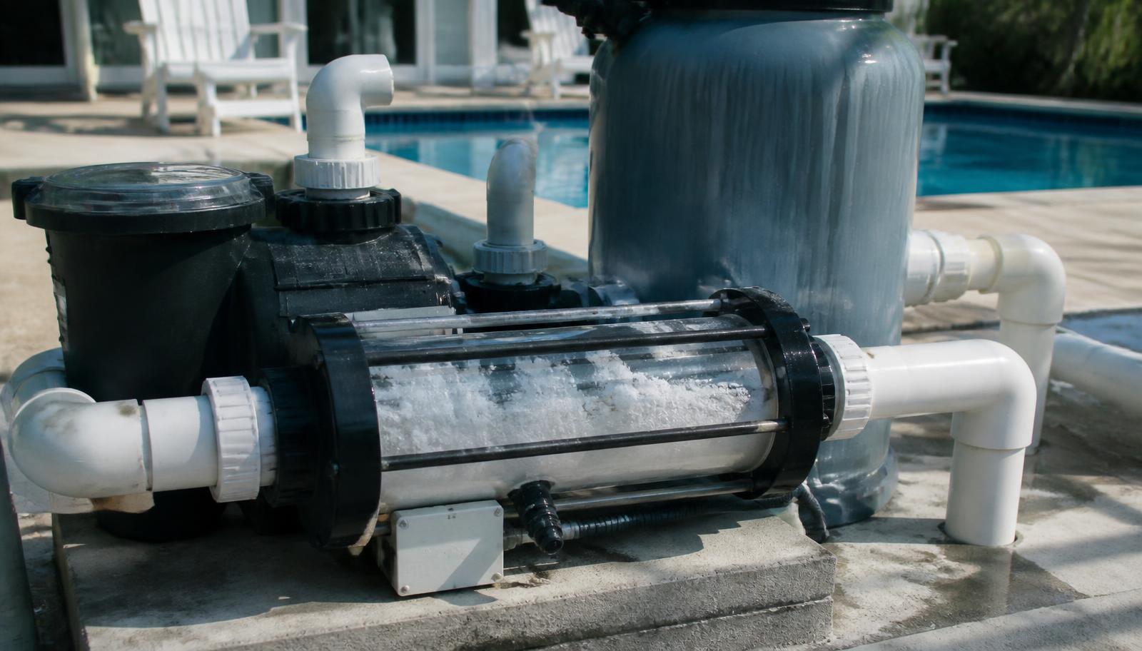 Saltwater chlorine generator cell and pool pump on a residential equipment pad