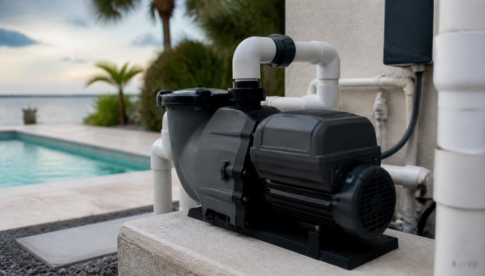Variable-speed pool pump installed on an equipment pad beside a Florida pool